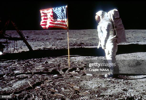 Astronaut Edwin "Buzz" Aldrin poses next to the U.S. Flag July 20, 1969 on the moon during the Apollo 11 mission.