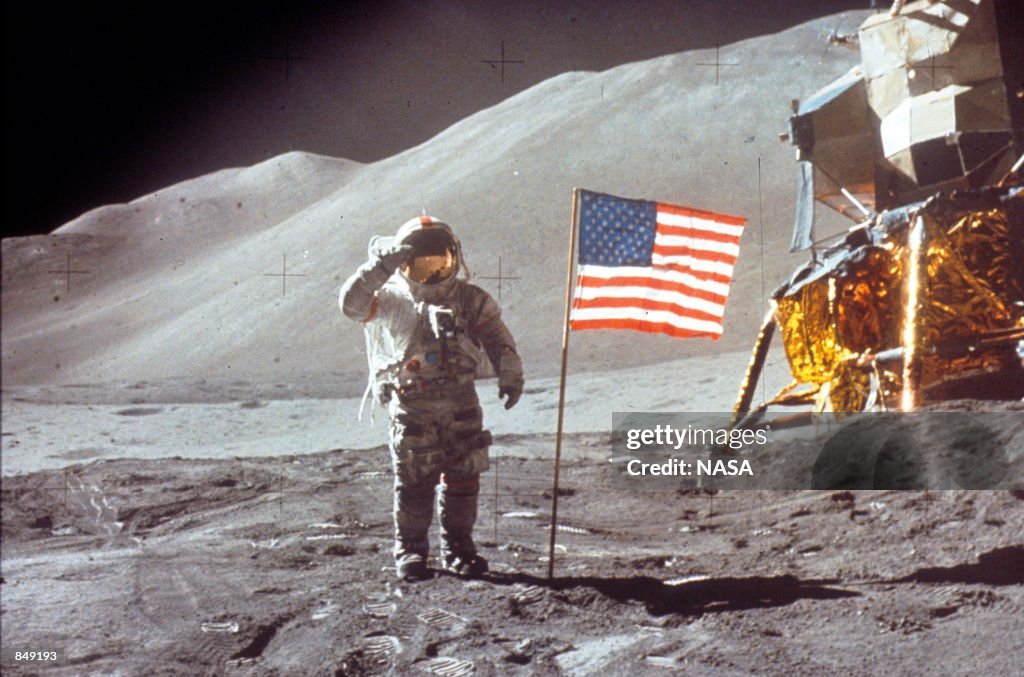 Astronaut David Scott Salutes by U.S. Flag
