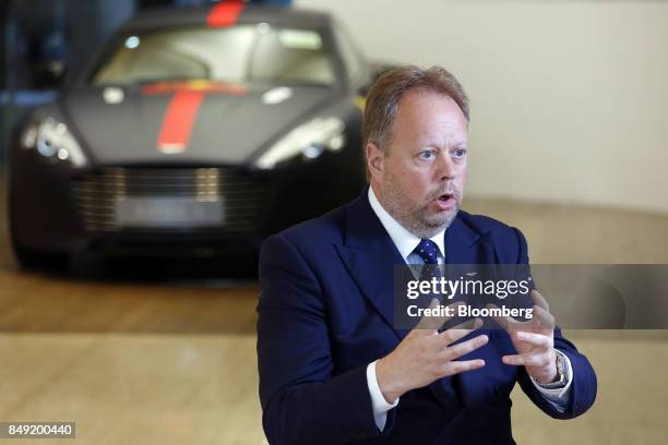 Andy Palmer, chief executive officer of Aston Martin Lagonda Ltd., speaks during a Bloomberg Television interview in Singapore, on Saturday, Sept....