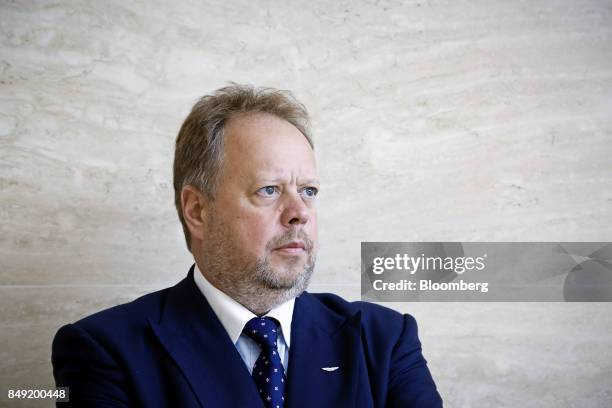 Andy Palmer, chief executive officer of Aston Martin Lagonda Ltd., poses for a photograph after a Bloomberg Television interview in Singapore, on...