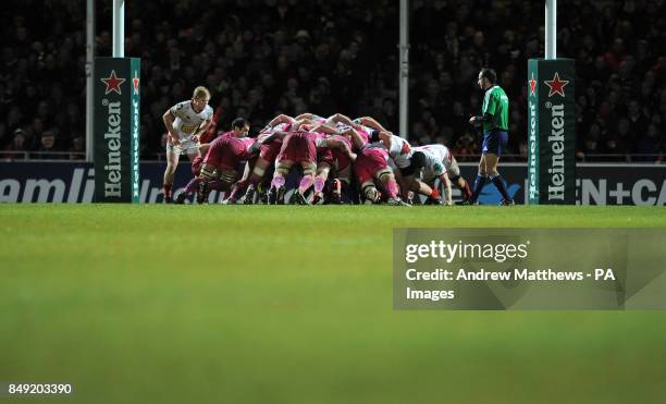 The Exter Chiefs and Scarlets players contest a scrum under the posts during the Heineken Cup, Pool Five match at Sandy Park, Exeter.