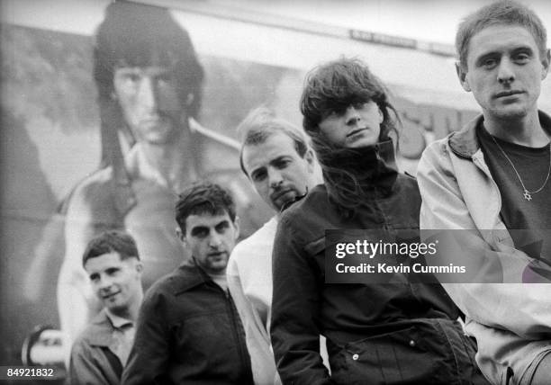 Manchester rock band Happy Mondays in front of a poster of Sylvester Stallone as Rambo, 2nd September 1985. Left to right: Gary Whelan, Paul Ryder,...