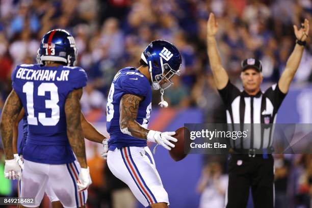 Evan Engram of the New York Giants celebrates with his teammate after scoring an 18 yard touchdown in the second quarter against the Detroit Lions...