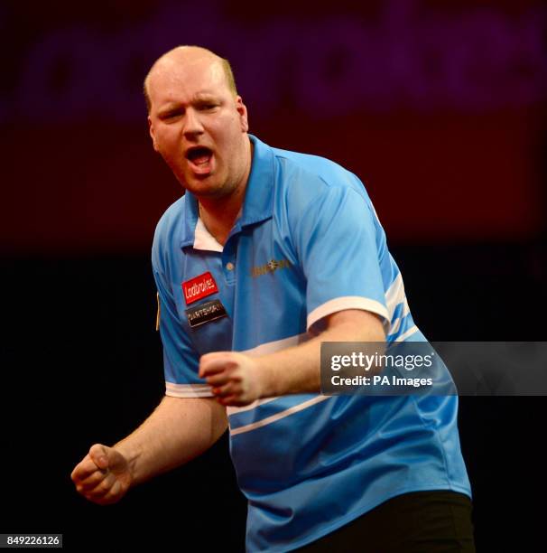 Vincent van der Voort celebrates winning the second set during the Ladbrokes.com World Darts Championship at Alexandra Palace, London.