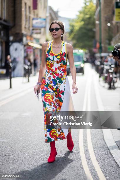 Guest wearing dress with floral print outside Marques Almeida during London Fashion Week September 2017 on September 18, 2017 in London, England.