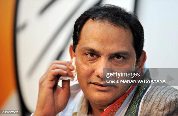 Md Azharuddin Former India cricket captain Mohammad Azharuddin wipes sweat from his ...