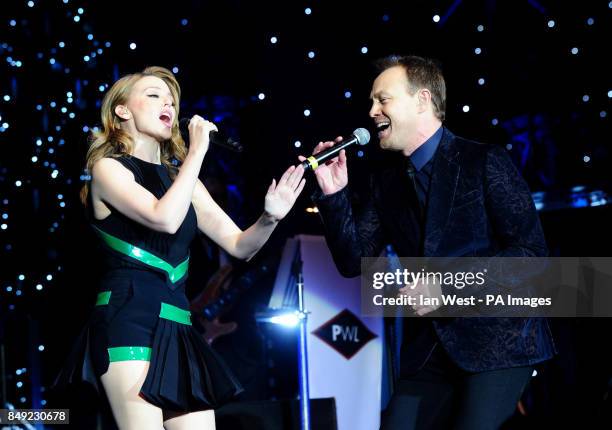 Kylie Minogue and Jason Donovan perform during the Hit Factory Live Christmas Cracker concert, at the O2 arena in London.