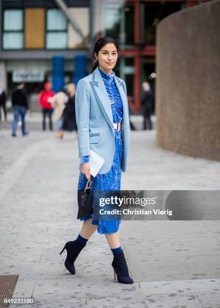 Caroline Issa wearing blue dress outside Christopher Kane during London Fashion Week September 2017 on September 18, 2017 in London, England.