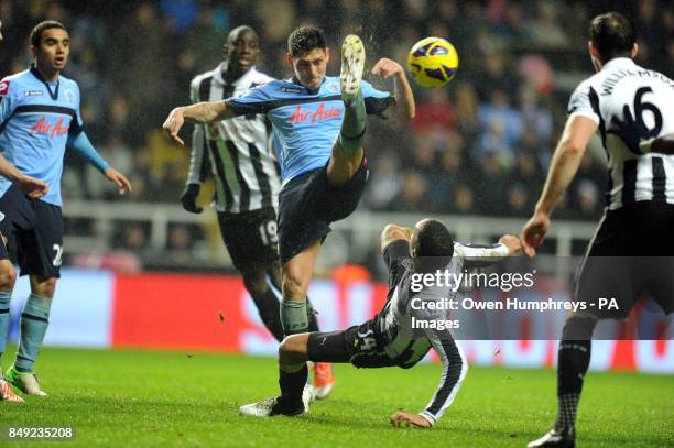 Newcastle's James Perch and QPR's Esteban Granero battle for the ball during the Barclays Premier League match at St James' Park, Newcastle.