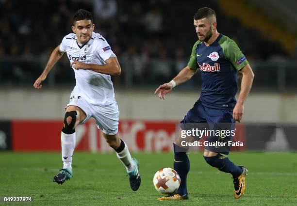 Salzburg midfielder Valon Berisha from Kosovo with Vitoria Guimaraes midfielder Guilherme Celis from Colombia in action during the UEFA Europa League...