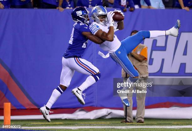 Marvin Jones of the Detroit Lions scores a 27 yard touchdown in the first quarter against Eli Apple of the New York Giants during their game at...