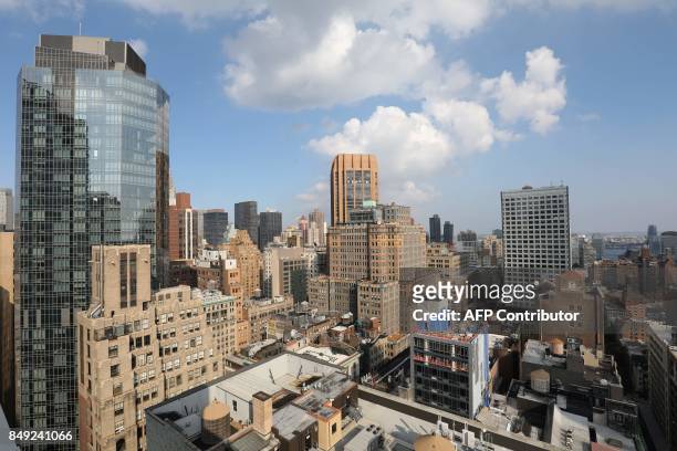 General view taken from the rooftop of a hotel in Manhattan shows New York City high rises on September 17, 2017. / AFP PHOTO / ludovic MARIN