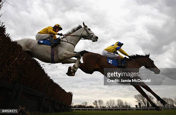 Pasco ridden by Sam Thomas jumps the last during the Weatherbys Cheltenham Festival Betting Guid 2009 during the at Huntingdon Race Course on...