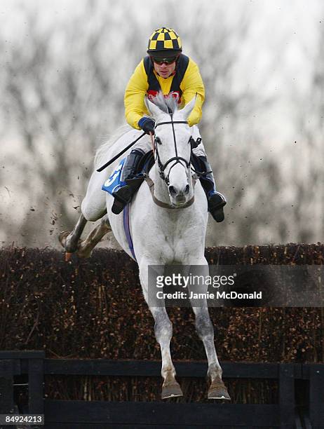 Pasco ridden by Sam Thomas jumps the last during the Weatherbys Cheltenham Festival Betting Guide 2009 Novices' Chase at Huntingdon Race Course on...