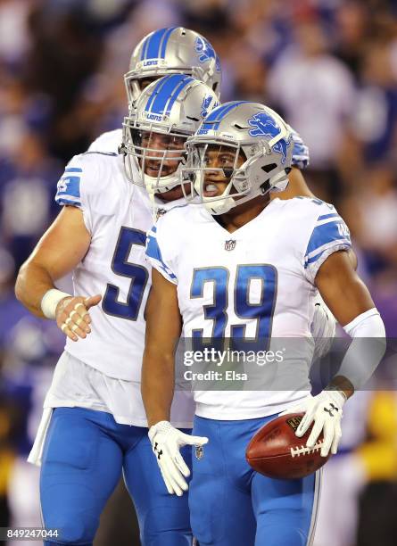 Jamal Agnew of the Detroit Lions celebrates after scoring an 88 yard punt return for a touchdown in the fourth quarter against the New York Giants...