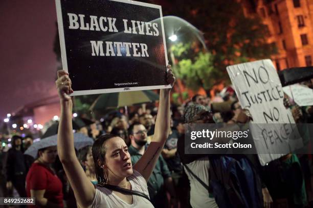 Demonstrators protest outside of the St. Louis city jail following the arrest of 123 people yesterday protesting the acquittal of former St. Louis...