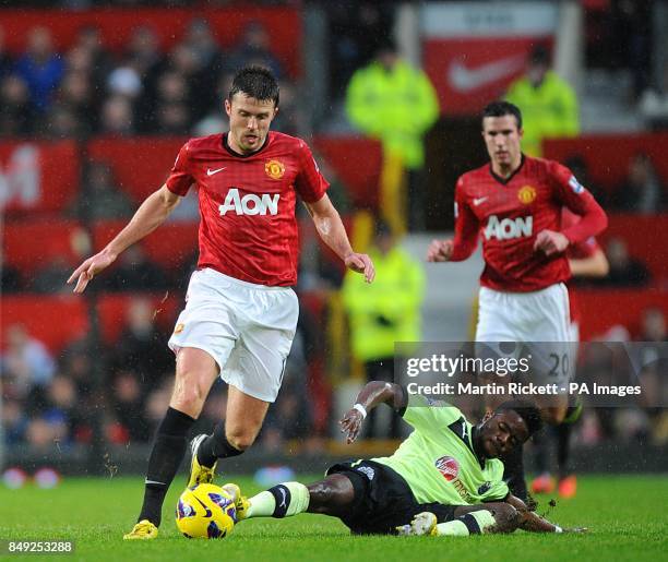 Newcastle United's Gael Bigirimana and Manchester United's Michael Carrick battle for the ball