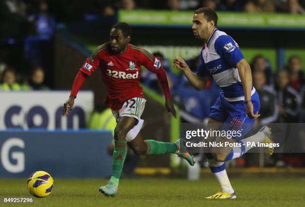 Swansea's Nathan Dyer breaks past Reading Adrian Mariappa during the Barclays Premier League match at the Madejski Stadium, Reading.