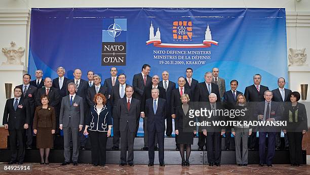 Defence Ministers of NATO countries pose for a family photo with NATO officials during meeting in Cracow, on February 19, 2009. Defence ministers are...