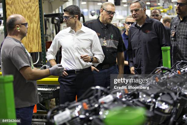 House Speaker Paul Ryan, a Republican from Wisconsin, second left, talks with company representatives as Matthew "Matt" Levatich, chief executive...