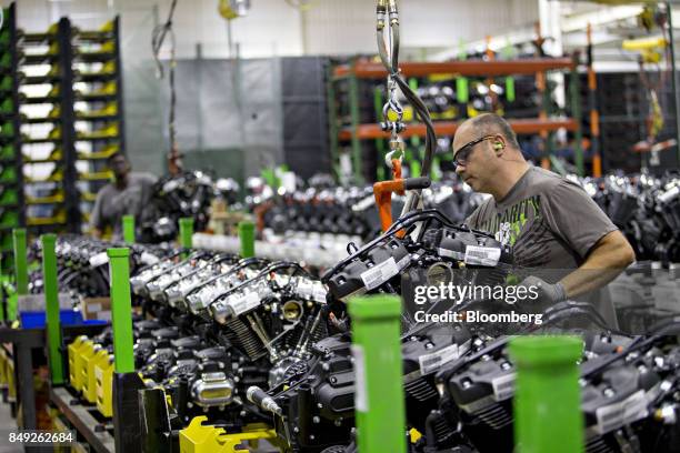 An employee moves an assembled engine at the Harley-Davidson Inc. Facility in Menomonee Falls, Wisconsin, U.S., on Monday, Sept. 18, 2017. The U.S....