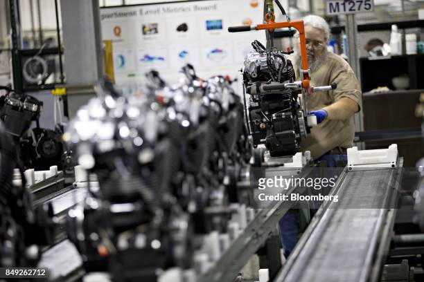 An employee moves an engine at the Harley-Davidson Inc. Facility in Menomonee Falls, Wisconsin, U.S., on Monday, Sept. 18, 2017. The U.S. Has to get...