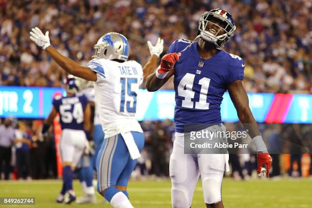Dominique Rodgers-Cromartie of the New York Giants reacts against Golden Tate of the Detroit Lions during their game at MetLife Stadium on September...