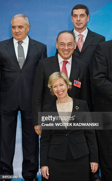 Norweigian Defence Minister Anne-Grete Strom-Erichsen and Hungarian Defence Minister Imre Szekeres smile as Turkish Defence Minister Mehmet Vecdi...