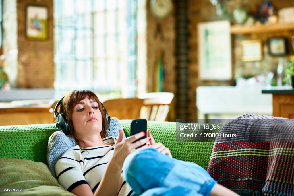 Woman relaxing on sofa
