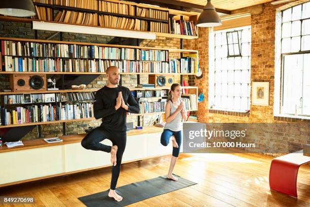 father and daughter practicing yoga - girl yoga stock pictures, royalty-free photos & images