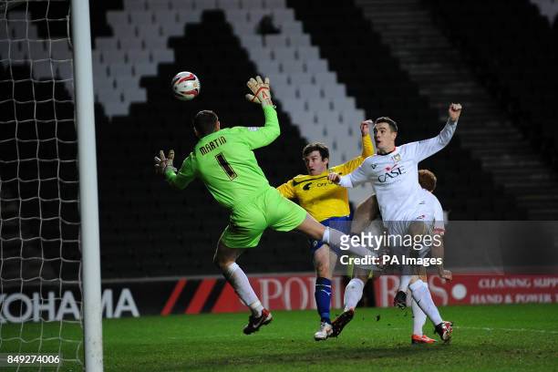 Coventry City's Stephen Elliott heads the ball past Milton Keynes Dons goalkeeper David Martin to score their second goal during the npower Football...