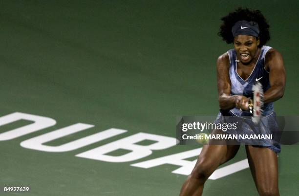 World number one Serena Willams of the US returns to Ana Ivanovic of Serbia during their WTA Dubai Tennis Championships quarter final match in the...