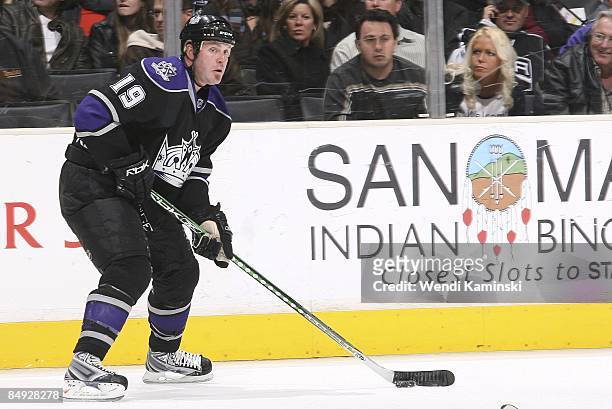 Kyle Calder of the Los Angeles Kings looks to pass the puck against the Calgary Flames on February 12, 2009 at Staples Center in Los Angeles,...