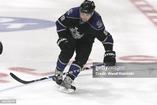 Drew Doughty of the Los Angeles Kings drives the puck against the Calgary Flames on February 12, 2009 at Staples Center in Los Angeles, California.