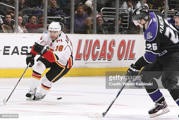 Matthew Lombardi the Calgary Flames drives the puck against Michal Handzus of the Los Angeles Kings on February 12, 2009 at Staples Center in Los...
