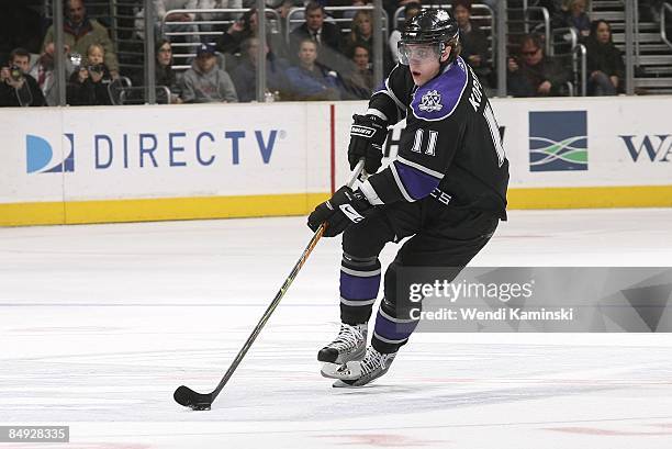 Anze Kopitar of the Los Angeles Kings drives the puck against the Calgary Flames on February 12, 2009 at Staples Center in Los Angeles, California.