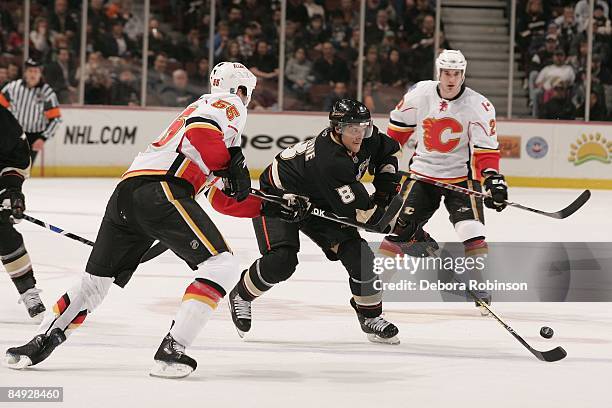Adam Pardy of the Calgary Flames defends against Teemu Selanne of the Anaheim Ducks during the game on February 11, 2009 at Honda Center in Anaheim,...