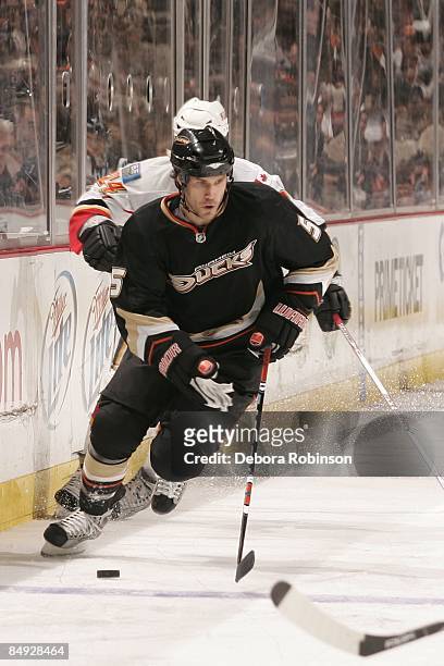 Steve Montador of the Anaheim Ducks drives the puck alongside the boards during the game against the Calgary Flames on February 11, 2009 at Honda...