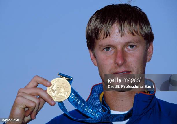 Yevgeny Kafelnikov of Russia with the gold medal for the men's singles tennis championship during the Summer Olympic Games in Sydney, Australia,...