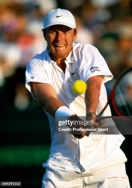 Yevgeny Kafelnikov of Russia in action during a men's singles match at the Ericsson Open Tennis Championships in Key Biscayne, Florida, circa April...