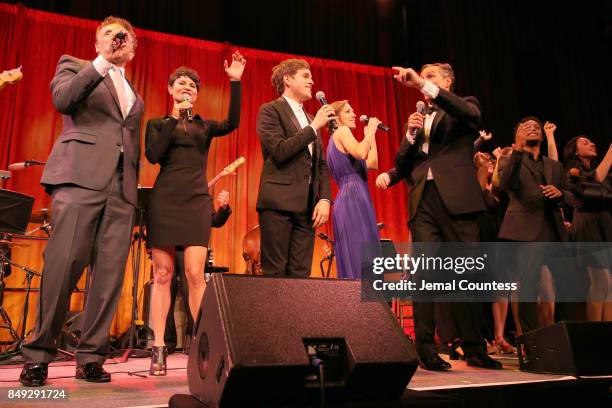 Evie Dolan, Brian Stokes Mitchell, Beth Malone, Taylor Trensch, Laura Osnes, and Howard McGillin perform onstage at the American Theatre Wing...