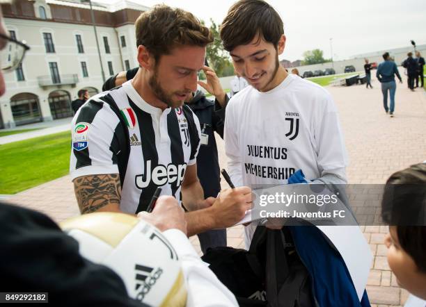 Juventus members meet player Claudio Marchisio during the official First Team Squad Photocall on September 18, 2017 in Turin, Italy.