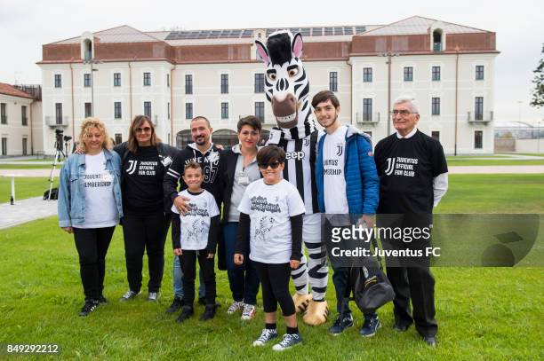 Juventus offical fan club members pose with club mascot Jay during the official First Team Squad Photocall on September 18, 2017 in Turin, Italy.