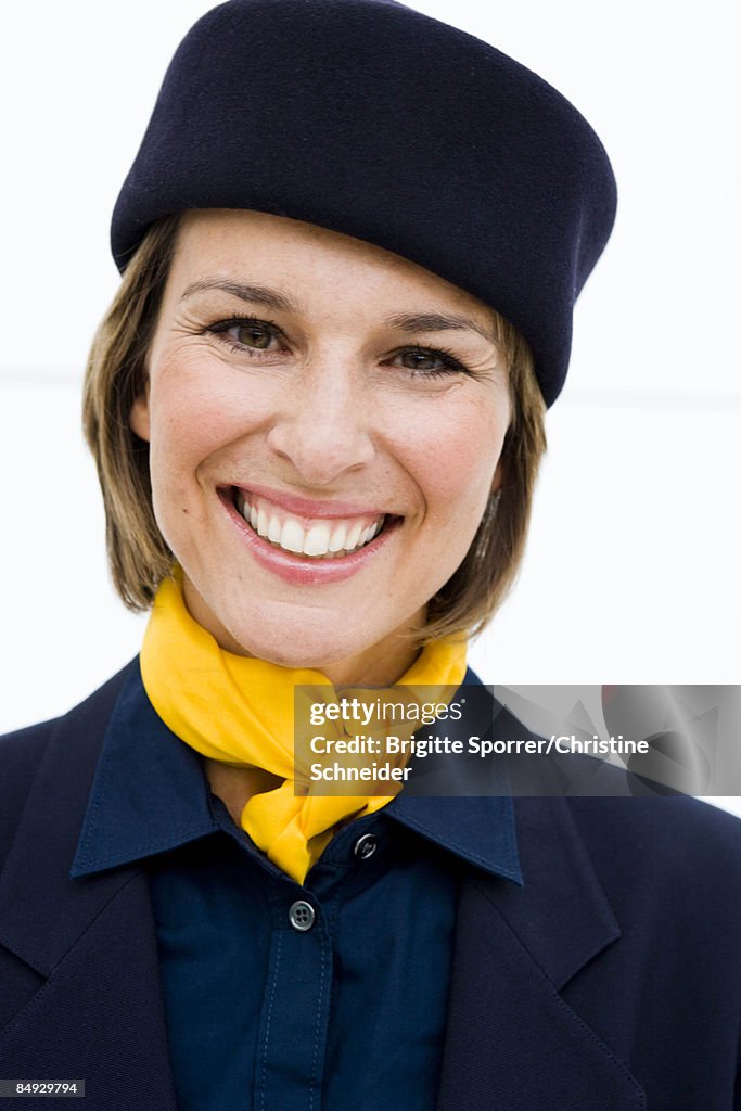 Stewardess smiling at viewer