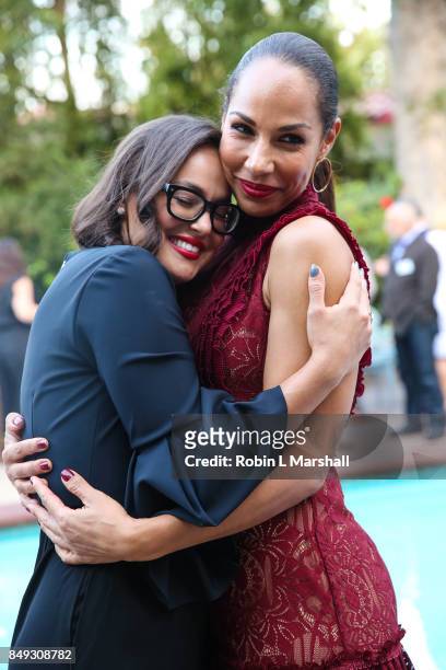 Actress Amanda Brugel embraces guest at the Canadian Consulate's Celebration for the Canadian Nominees of the 69th Emmy Awards at Official Residence...