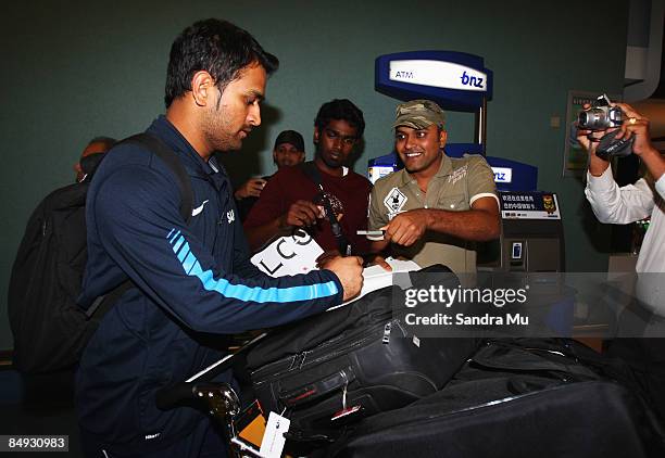 Dhoni of India walks through the arrivals hall as the Indian cricket team arrive at Auckland International Airport on February 20, 2009 in Auckland,...