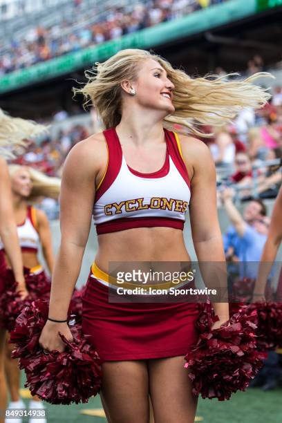 An Iowa State Cyclones cheerleader performs on the sideline during the first quarter of the college football game between the Iowa State Cyclones and...