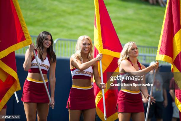 Iowa State Cyclones cheerleaders prepare to dun the Iowa State banners on the field prior to the college football game between the Iowa State...