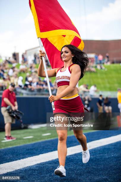 An Iowa State Cyclones cheerleader run the Iowa State banners thru the end zone after an Iowa State touchdown during the first quarter of the college...