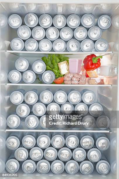 fridge full of beer cans  - beer fridge stock-fotos und bilder